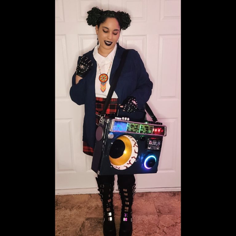 Me posing in my Kat from Wendell & Wild Cosplay with my lit up Boom Box